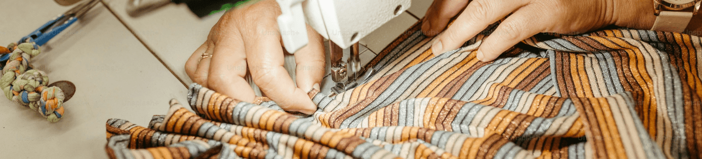 Hands working with striped fabric