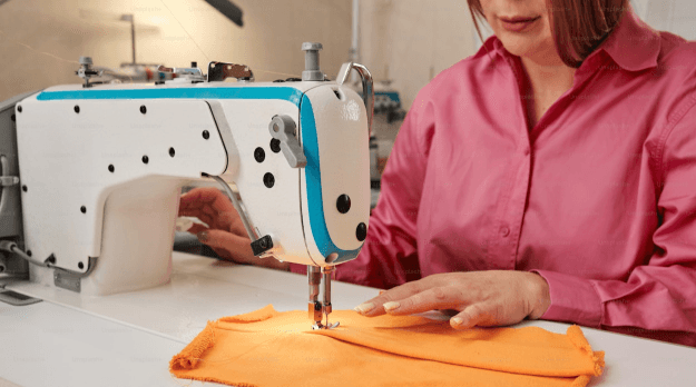 Person working on sewing machine
